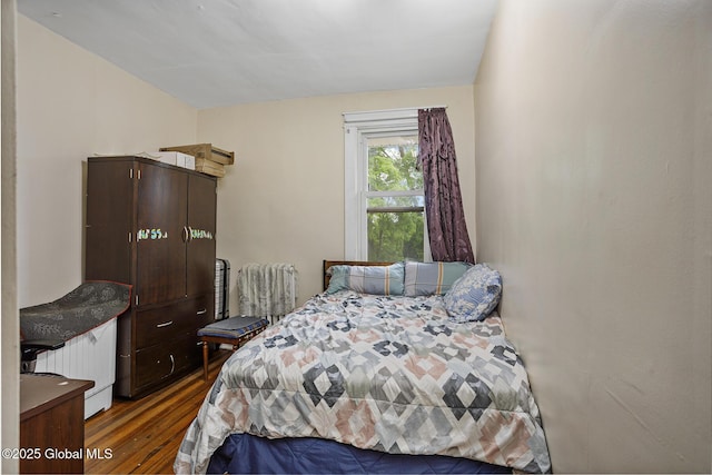 2303 Burdett Ave, Troy, NY 12180 - bedroom featuring wood finished floors and radiator heating unit