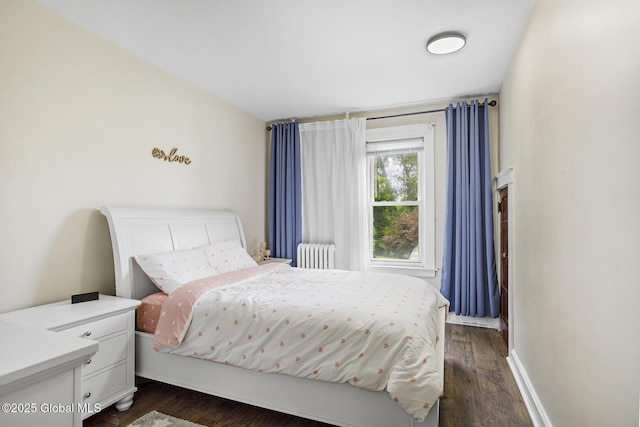 2303 Burdett Ave, Troy, NY 12180 - bedroom with radiator heating unit and dark wood finished floors
