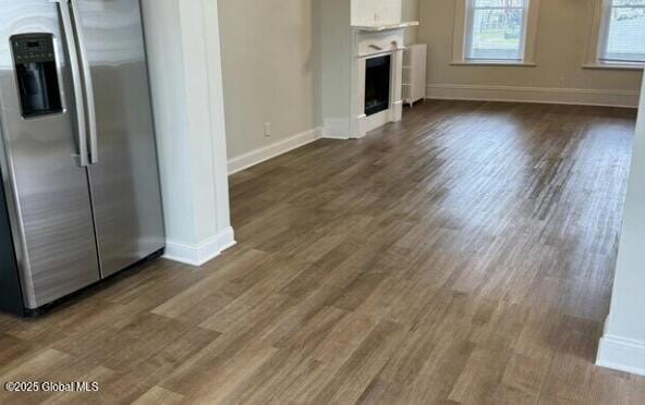 47 Chestnut St, Rensselaer, NY 12144 - unfurnished living room featuring dark wood-type flooring and a fireplace