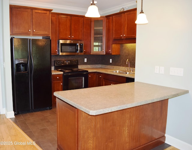 9 Lancaster Pl, Milton, NY 12020 - kitchen featuring black appliances, tasteful backsplash, light countertops, glass insert cabinets, and pendant lighting