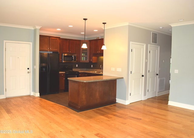 9 Lancaster Pl, Milton, NY 12020 - kitchen with black appliances, a peninsula, light wood-style floors, recessed lighting, and pendant lighting