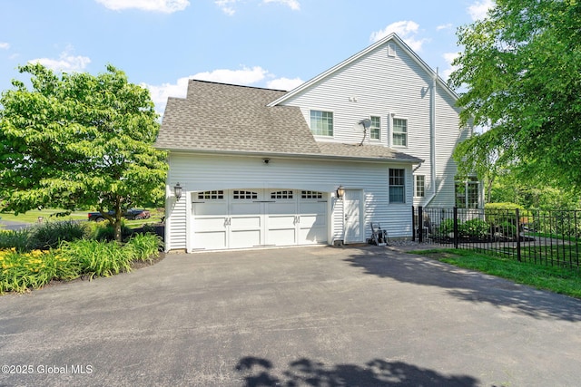 11 Fairview Ln, Halfmoon, NY 12118 - view of front of home featuring driveway, a garage, and a shingled roof