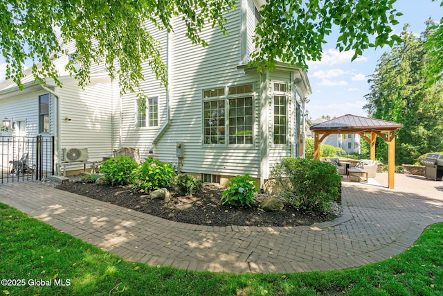 11 Fairview Ln, Halfmoon, NY 12118 - view of side of property featuring a gazebo and a patio area