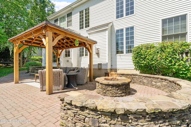 11 Fairview Ln, Halfmoon, NY 12118 - view of patio featuring a gazebo and an outdoor living space with a fire pit