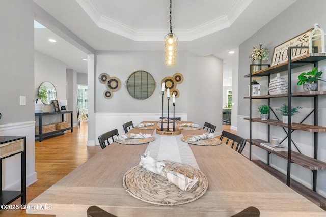 11 Fairview Ln, Halfmoon, NY 12118 - dining space featuring wood finished floors, a raised ceiling, ornamental molding, and recessed lighting