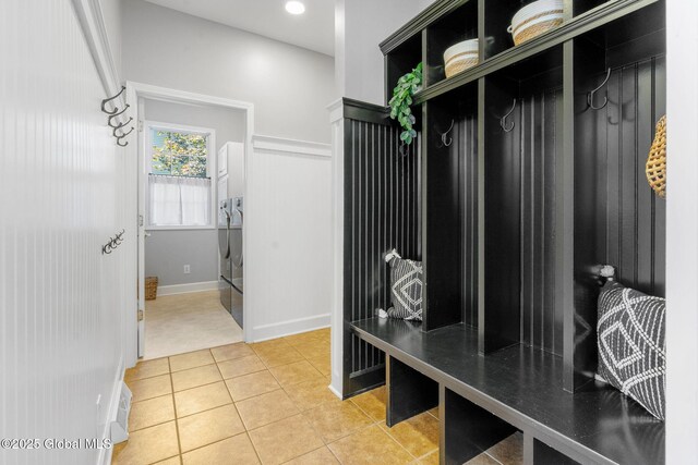 11 Fairview Ln, Halfmoon, NY 12118 - mudroom featuring light tile patterned flooring and washing machine and clothes dryer