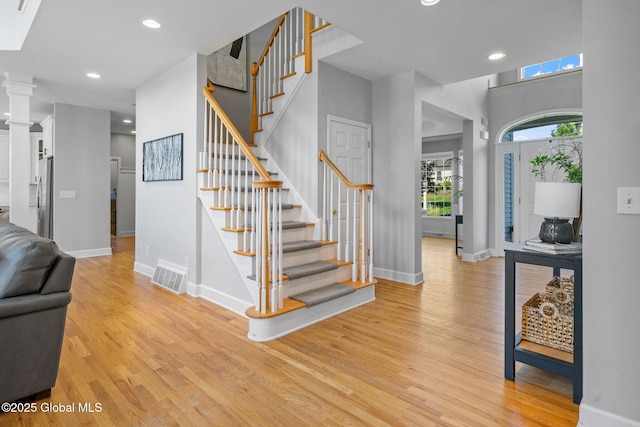 11 Fairview Ln, Halfmoon, NY 12118 - entryway featuring light wood-type flooring, stairs, and recessed lighting