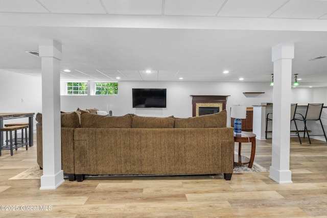 11 Fairview Ln, Halfmoon, NY 12118 - living room featuring light wood-style floors, recessed lighting, and a fireplace