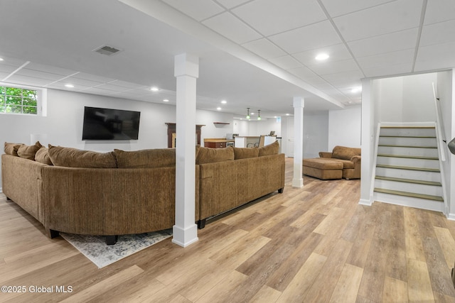 11 Fairview Ln, Halfmoon, NY 12118 - living area with light wood-style flooring, stairway, a paneled ceiling, and bar area