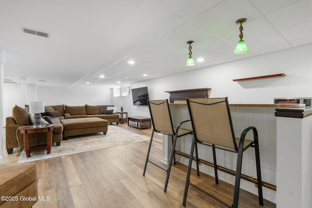 11 Fairview Ln, Halfmoon, NY 12118 - living room featuring a dry bar, wood finished floors, recessed lighting, and a paneled ceiling