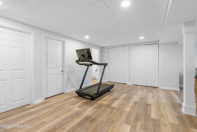 11 Fairview Ln, Halfmoon, NY 12118 - exercise room with light wood-style floors, a paneled ceiling, and recessed lighting