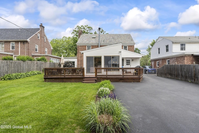 101 Euclid Ave, Albany, NY 12203 - back of property with a wooden deck, a chimney, and brick siding