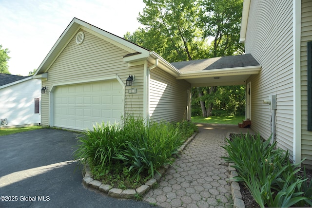 21 Cabot Way, Halfmoon, NY 12065 - view of side of home with a garage and asphalt driveway