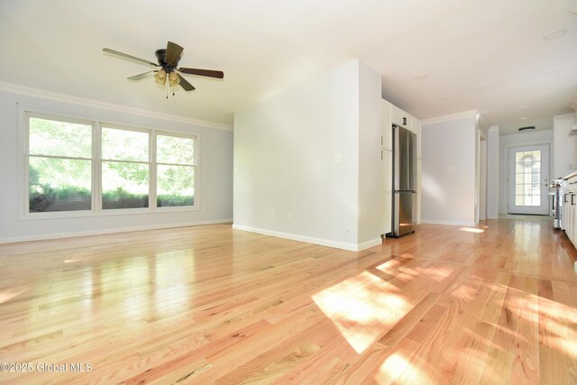21 Cabot Way, Halfmoon, NY 12065 - unfurnished living room with light wood-type flooring, crown molding, and a ceiling fan