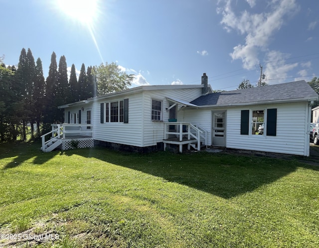 65 W Broadway, Salem, NY 12865 - rear view of house featuring a yard, a shingled roof, a wooden deck, and a chimney