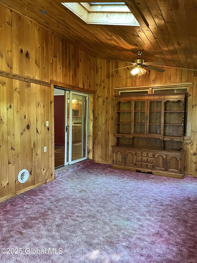 65 W Broadway, Salem, NY 12865 - unfurnished living room with a skylight, lofted ceiling, wooden walls, carpet, and wooden ceiling