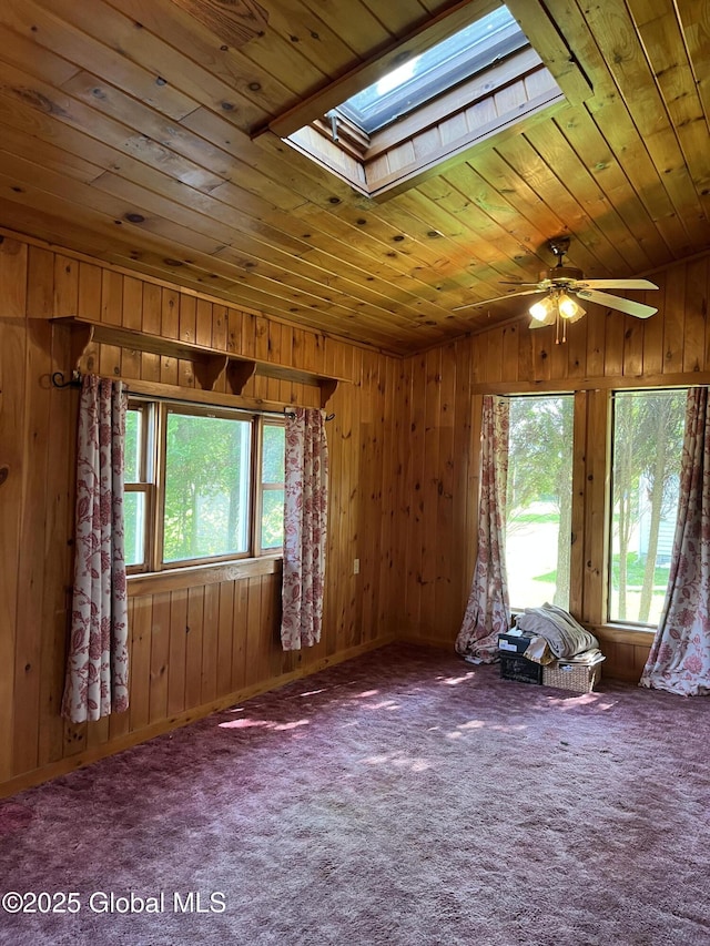 65 W Broadway, Salem, NY 12865 - carpeted empty room with a skylight, wooden ceiling, ceiling fan, and wooden walls