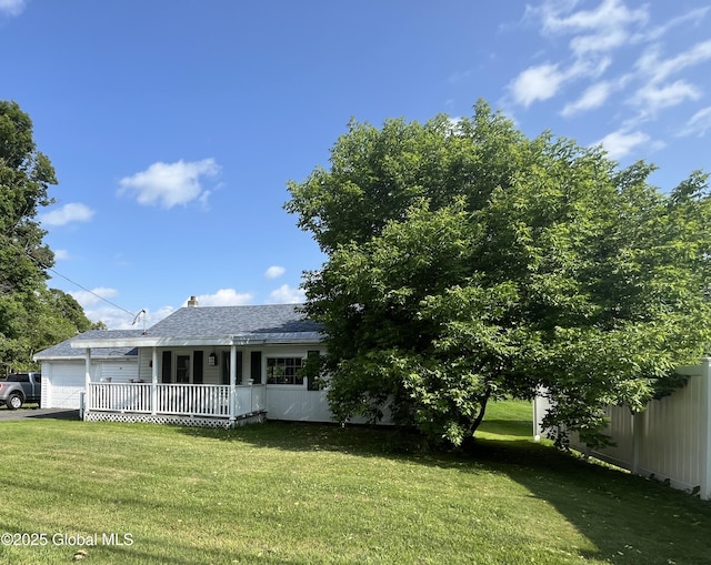 65 W Broadway, Salem, NY 12865 - view of front of property featuring a garage, a front lawn, a porch, a shingled roof, and a chimney