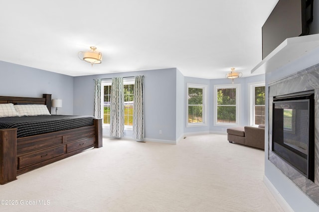 7 Anthony Ln, Saratoga Springs, NY 12866 - bedroom with a tiled fireplace, multiple windows, and carpet floors