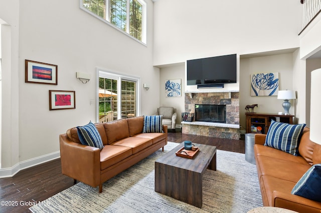 7 Anthony Ln, Saratoga Springs, NY 12866 - living area with a high ceiling, wood finished floors, and a stone fireplace