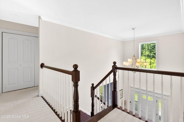 7 Anthony Ln, Saratoga Springs, NY 12866 - staircase with a chandelier, carpet floors, and crown molding