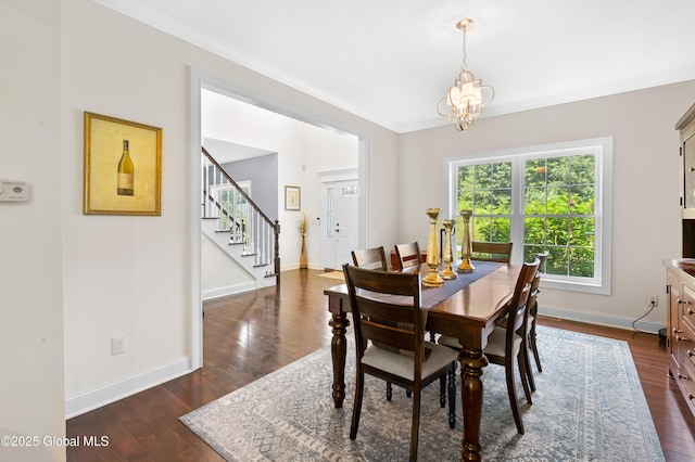 7 Anthony Ln, Saratoga Springs, NY 12866 - dining area featuring stairway, dark wood-style floors, crown molding, and a chandelier