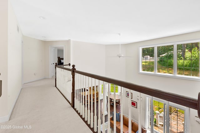 7 Anthony Ln, Saratoga Springs, NY 12866 - hallway featuring light carpet and baseboards
