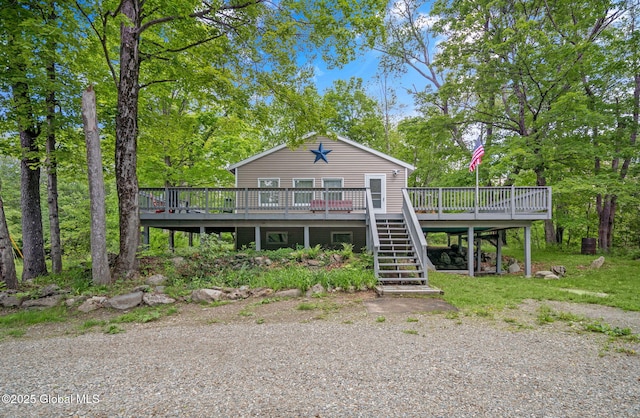 633 Moore Hill Rd, Stephentown, NY 12168 - view of front of property featuring a wooden deck, stairs, and view of scattered trees