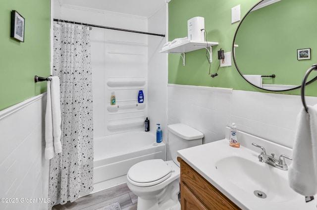 633 Moore Hill Rd, Stephentown, NY 12168 - full bath featuring vanity, shower / bath combination with curtain, a wainscoted wall, and wood finished floors