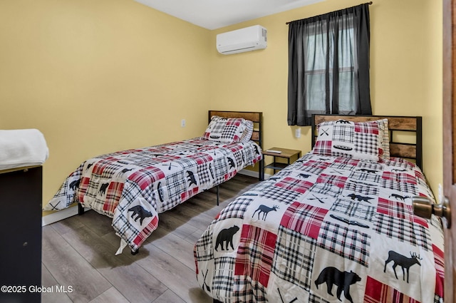 633 Moore Hill Rd, Stephentown, NY 12168 - bedroom with a wall unit AC and wood finished floors