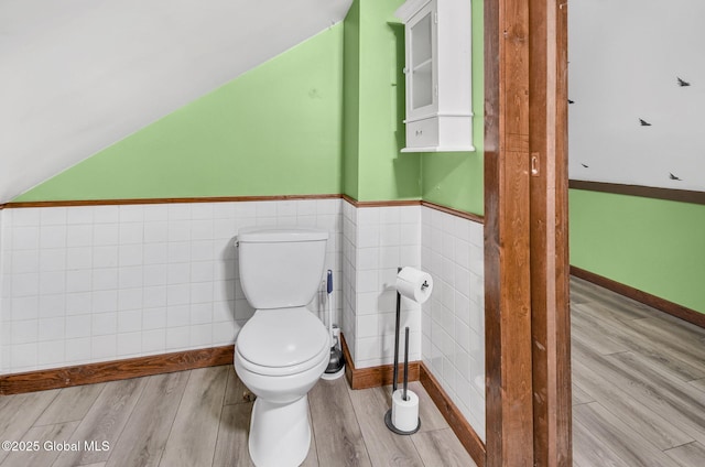 633 Moore Hill Rd, Stephentown, NY 12168 - half bathroom featuring tile walls, wood finished floors, and a wainscoted wall