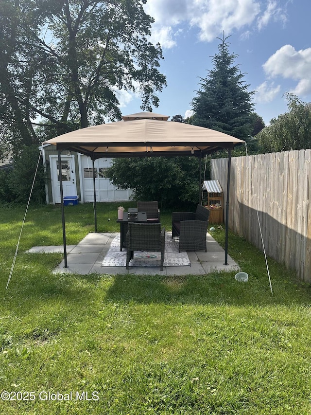 246 Fourteenth St, Schenectady, NY 12306 - fenced backyard with a gazebo, a patio, and an outdoor hangout area