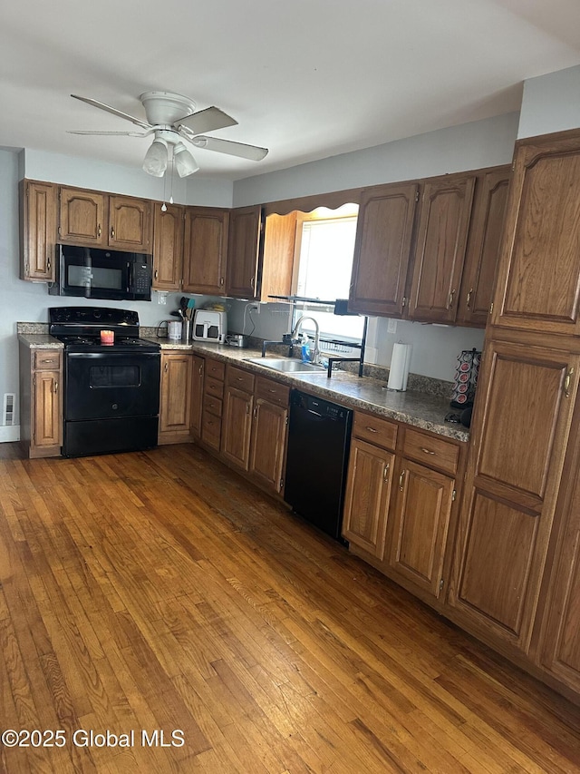 246 Fourteenth St, Schenectady, NY 12306 - kitchen featuring black appliances, dark wood finished floors, and ceiling fan