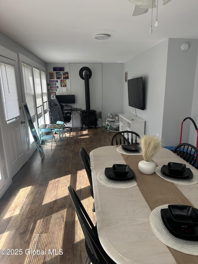 246 Fourteenth St, Schenectady, NY 12306 - dining area featuring hardwood / wood-style flooring, a wood stove, and ceiling fan