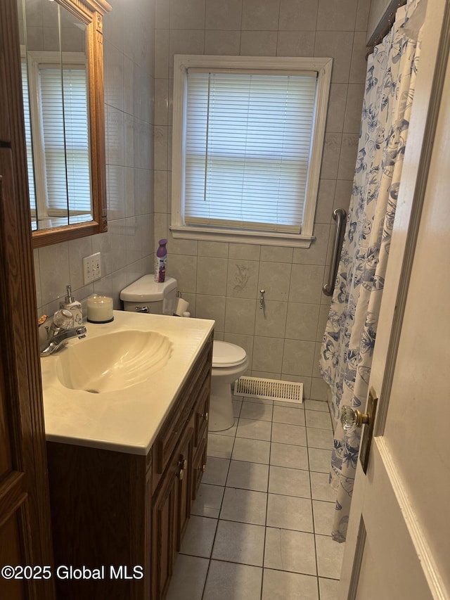 246 Fourteenth St, Schenectady, NY 12306 - bathroom featuring tile walls, tile patterned floors, vanity, and a shower with shower curtain
