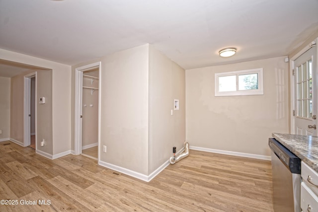 901 Adams St, Rotterdam, NY 12306 - kitchen featuring stainless steel dishwasher, light wood-style floors, and light stone counters
