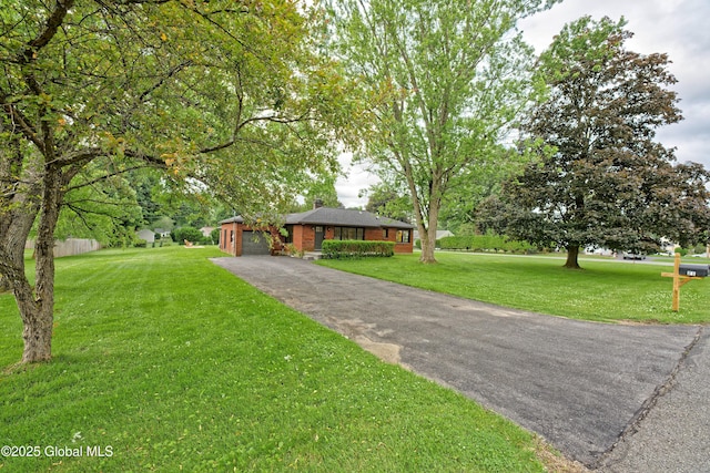 21 Crooked St, Charlton, NY 12019 - view of front facade with driveway, a front lawn, an attached garage, and a chimney