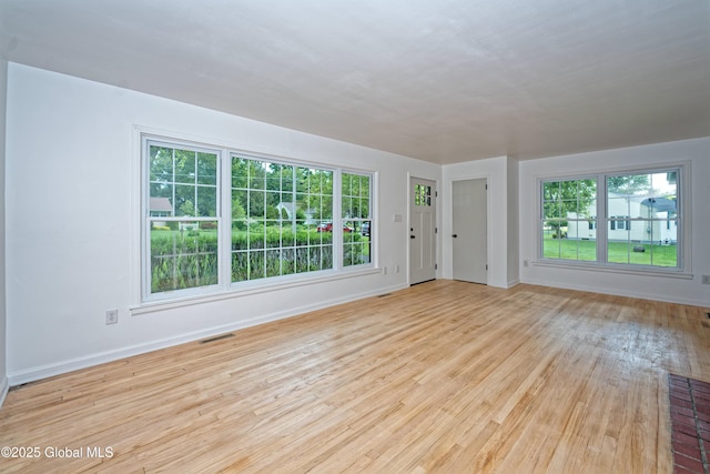 21 Crooked St, Charlton, NY 12019 - unfurnished living room with wood finished floors and baseboards