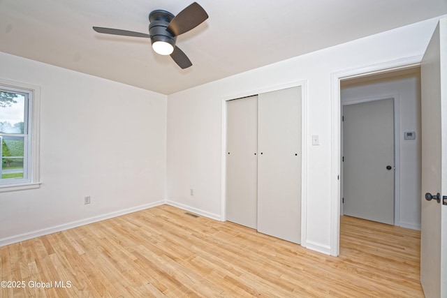 21 Crooked St, Charlton, NY 12019 - unfurnished bedroom with light wood-style floors, a closet, and a ceiling fan