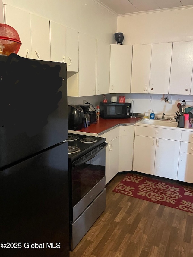 21-25 Mohawk St, Fort Plain, NY 13339 - kitchen featuring black appliances, dark wood-style flooring, white cabinetry, and crown molding