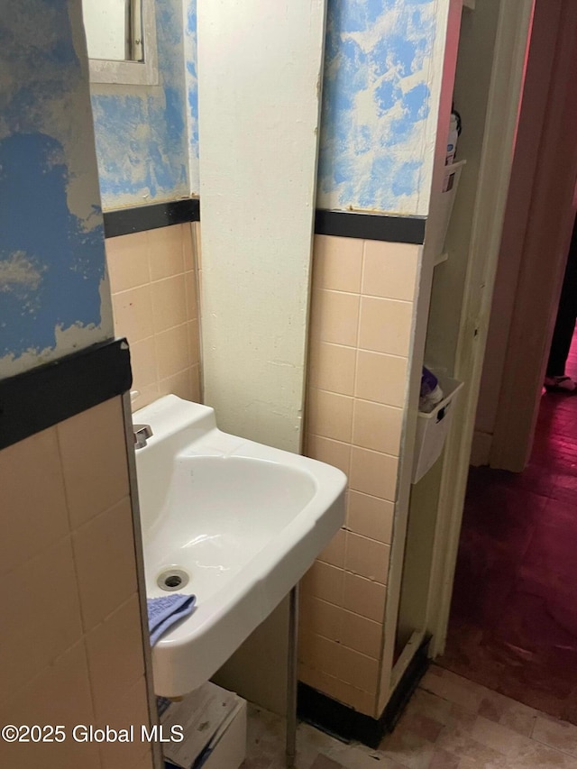 21-25 Mohawk St, Fort Plain, NY 13339 - bathroom featuring tile walls and a wainscoted wall