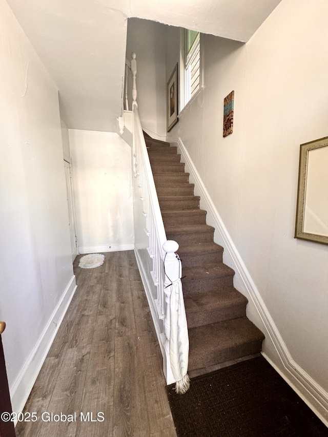 358 2nd St, Albany, NY 12206 - stairway featuring wood finished floors and baseboards
