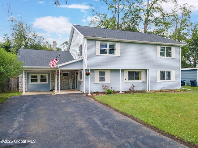 3445 Gari Ln, Guilderland, NY 12303 - view of front facade with a chimney, asphalt driveway, and stone siding