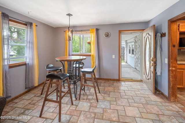3445 Gari Ln, Guilderland, NY 12303 - dining space featuring plenty of natural light and light stone finish floors