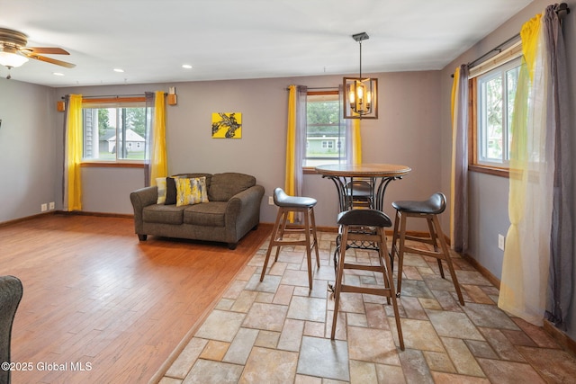 3445 Gari Ln, Guilderland, NY 12303 - dining area with recessed lighting, a ceiling fan, and a chandelier