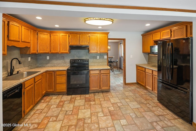 3445 Gari Ln, Guilderland, NY 12303 - kitchen featuring black appliances, under cabinet range hood, tasteful backsplash, brown cabinets, and recessed lighting