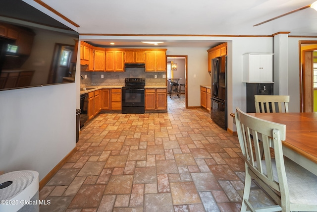 3445 Gari Ln, Guilderland, NY 12303 - kitchen with black appliances, under cabinet range hood, tasteful backsplash, light countertops, and brown cabinets