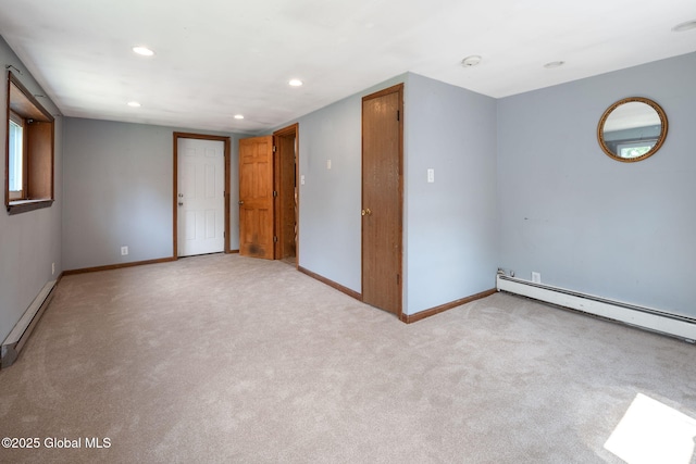 3445 Gari Ln, Guilderland, NY 12303 - unfurnished room with a baseboard heating unit, recessed lighting, light colored carpet, and baseboard heating