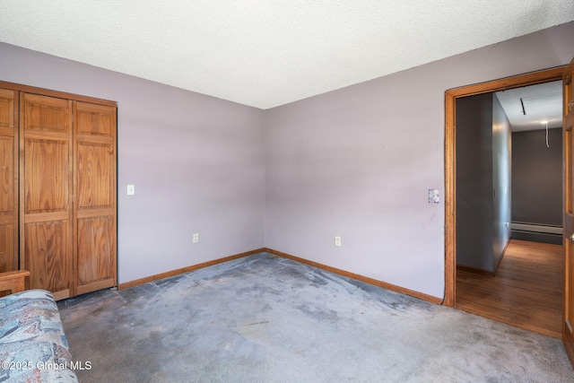 3445 Gari Ln, Guilderland, NY 12303 - unfurnished bedroom featuring carpet floors, a baseboard heating unit, and attic access