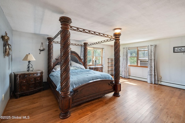 3445 Gari Ln, Guilderland, NY 12303 - bedroom featuring wood finished floors and a textured ceiling